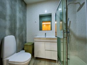 a bathroom with a toilet and a sink and a shower at Adore Portugal Bungalow Natureza & Vista de Serra in Lousã