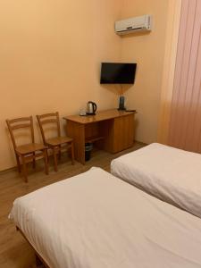 Postel nebo postele na pokoji v ubytování Inn on Zhytomyrska