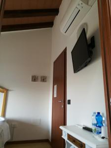 TV a/nebo společenská místnost v ubytování B&B L'Upupa