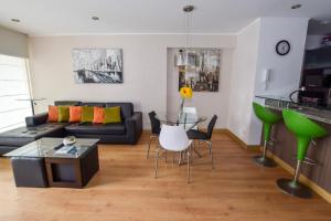 a living room with a couch and a table at Miraflores Apartments 570 Pardo Ave by Private Host in Lima