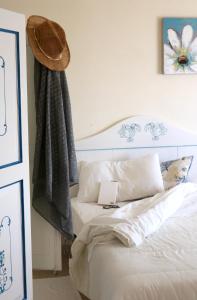 Un pat sau paturi într-o cameră la La Rosa dei Venti