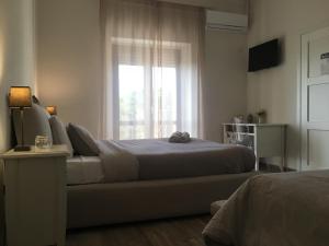 A bed or beds in a room at Don Giacchì Country House