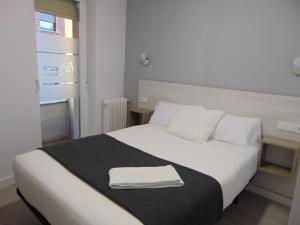 Postel nebo postele na pokoji v ubytování Hostal I Dream Salamanca
