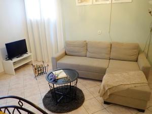 a living room with a couch and a table at Apartments Marija in Karlobag +57 photos