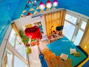 an overhead view of a room with a bed and a balloon at Fairy house in Petrovo