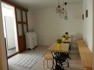 a room with a table and chairs and a dining room at Jacob's Hotel TUI in Tui