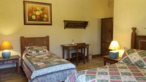 A Casa Vermelha Hospedaria客房内的一张或多张床位
