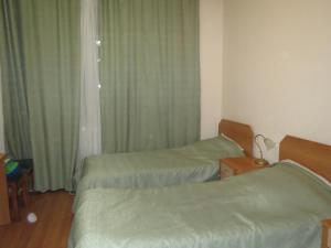 Cama o camas de una habitación en Guest House Avenue