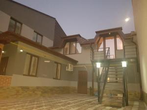 a house with a staircase in front of it at Casa Lions in Timişoara