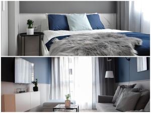een slaapkamer met een bed en een woonkamer bij NavyBlue apartment Cracow free parking TV in Krakau