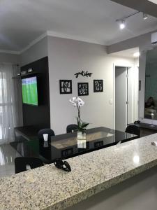 TV a/nebo společenská místnost v ubytování Apartamento novo bertioga