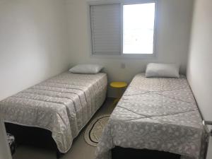 Postel nebo postele na pokoji v ubytování Apartamento novo bertioga