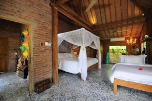 Postel nebo postele na pokoji v ubytování Bali Lush