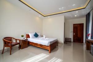Rúm í herbergi á Sum villa Hoi An
