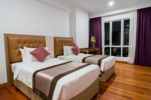Postel nebo postele na pokoji v ubytování Tamu Hotel & Suites Kuala Lumpur