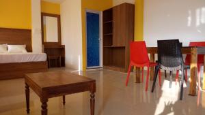 Posezení v ubytování Adams Wood House Ayurveda Homestay Kochi
