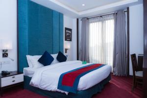 Кровать или кровати в номере M Hotel Thamel-Kathmandu