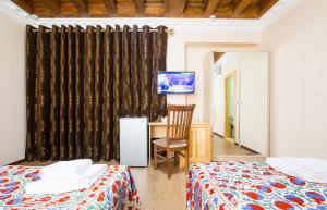 Postel nebo postele na pokoji v ubytování Basilic Boutique Hotel