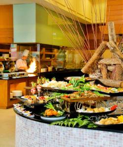 a buffet line with many plates of food at Royale Chulan Kuala Lumpur in Kuala Lumpur