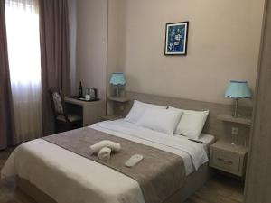 Voodi või voodid majutusasutuse Family Hotel Triston toas
