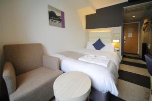 Postel nebo postele na pokoji v ubytování Hotel Sunroute Stellar Ueno
