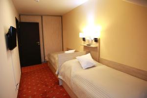 Letto o letti in una camera di Pension Dvořák