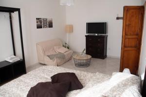A bed or beds in a room at Alloggio Turistico al Civico n 32