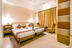 Postel nebo postele na pokoji v ubytování Hotel Sadanand Regency + 20 fotografií