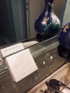 two vases on display on a glass display case at La Gracette in Aix-en-Provence