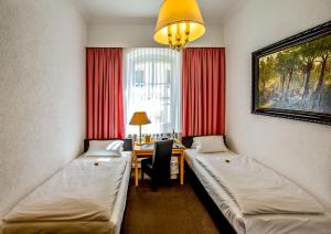 Postel nebo postele na pokoji v ubytování Hotel Adler