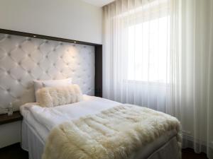 Voodi või voodid majutusasutuse Hotel Riverton toas