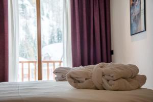 Postel nebo postele na pokoji v ubytování Hotel Dufour