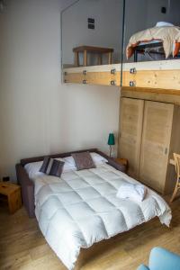 Postel nebo postele na pokoji v ubytování Hotel Dufour