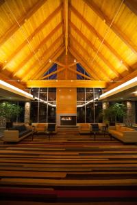 a church with a wooden ceiling and chairs and a fireplace at Radisson Hotel & Convention Center Edmonton in Edmonton