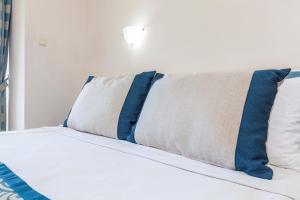 A bed or beds in a room at Galaxy Beach Hotel Alanya