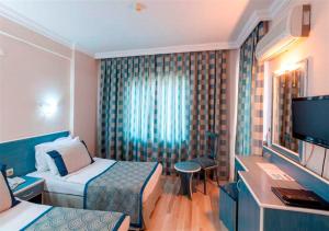 A television and/or entertainment centre at Galaxy Beach Hotel Alanya