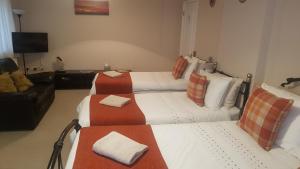 Ένα ή περισσότερα κρεβάτια σε δωμάτιο στο Cleeves Cottage