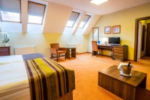 Ένα ή περισσότερα κρεβάτια σε δωμάτιο στο Hotel BELASSI