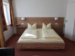 Postel nebo postele na pokoji v ubytování Pension Gregory