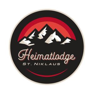 a badge of the thermidride st nicholas logo at Hotel Heimatlodge in Sankt Niklaus