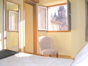 Łóżko lub łóżka w pokoju w obiekcie Apartamentos Casa de La Inmaculada