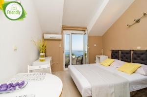 Posteľ alebo postele v izbe v ubytovaní Plavac Mali Suites