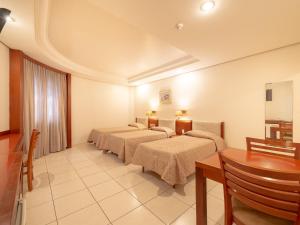 Cama ou camas em um quarto em Real Castilha Hotel