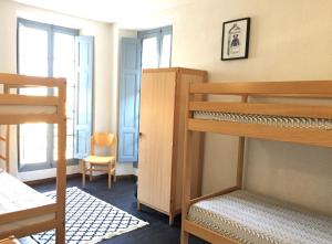 מיטה או מיטות קומותיים בחדר ב-Gîte du Chalet Pietri