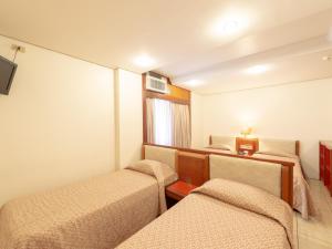 Cama ou camas em um quarto em Real Castilha Hotel