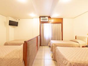 Cama ou camas em um quarto em Real Castilha Hotel