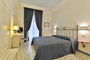 Postel nebo postele na pokoji v ubytování La Pineta Hotel Beach & Spa
