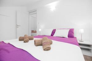 Ένα ή περισσότερα κρεβάτια σε δωμάτιο στο Apartmani Gnjidic
