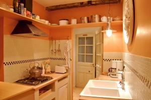 a kitchen with a sink and a counter top at Studio Rempart in Brussels +125 photos