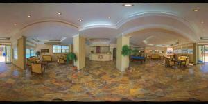 a lobby with chairs and tables in a building at meryemana hotel in Didim +94 photos
